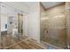 Modern bathroom with glass shower, wood look tile flooring, and view into main bedroom at 686 E Vermont Dr, Gilbert, AZ 85295