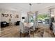 Dining room with stylish light fixture, window overlooking the backyard, and elegant decor at 686 E Vermont Dr, Gilbert, AZ 85295