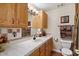 Well-maintained bathroom featuring a vanity with storage and a tiled countertop at 7216 W Country Gables Dr, Peoria, AZ 85381