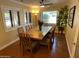 Inviting dining room with a large wooden table, seating for eight, and ample natural light at 7216 W Country Gables Dr, Peoria, AZ 85381