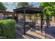 Beautiful outdoor dining area featuring a gazebo with a table and chairs, perfect for entertaining at 7216 W Country Gables Dr, Peoria, AZ 85381