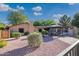 Inviting backyard featuring a gazebo with table and chairs, surrounded by manicured landscaping and peaceful ambiance at 7216 W Country Gables Dr, Peoria, AZ 85381