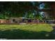 Manicured lawn showcasing a home with a gazebo, enhancing its curb appeal and charm at 7216 W Country Gables Dr, Peoria, AZ 85381