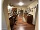 Open-concept kitchen with granite countertops, wooden cabinets, and views into the adjoining living space at 7216 W Country Gables Dr, Peoria, AZ 85381