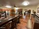 Open kitchen featuring granite counters, wooden cabinets, a breakfast bar, and stainless steel appliances at 7216 W Country Gables Dr, Peoria, AZ 85381