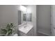 This bathroom features a neutral color palette, vanity and modern lighting at 738 W Kingman Dr, Casa Grande, AZ 85122