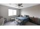 This bedroom features a ceiling fan, comfortable queen bed, and soft neutral tones at 738 W Kingman Dr, Casa Grande, AZ 85122