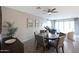 Open concept dining area featuring a round wood table, six chairs and a view of the adjacent living room at 738 W Kingman Dr, Casa Grande, AZ 85122