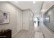 This hallway features light wood floors, modern art pieces and neutral paint at 738 W Kingman Dr, Casa Grande, AZ 85122