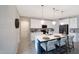 Kitchen island with seating, stylish pendant lights, and lots of white cabinets provides a modern and inviting space at 738 W Kingman Dr, Casa Grande, AZ 85122