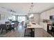 Bright kitchen with modern countertops, stainless steel appliances, and open layout into the dining and living areas at 738 W Kingman Dr, Casa Grande, AZ 85122