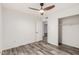 Neutral bedroom with ceiling fan, door to hallway, and closet at 8027 E Quarterline Rd, Mesa, AZ 85207