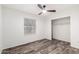 Bedroom featuring closet, window, and modern ceiling fan at 8027 E Quarterline Rd, Mesa, AZ 85207