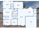 Detailed floor plan showcasing the layout with dimensions of all rooms, including two living spaces and a spacious garage at 8027 E Quarterline Rd, Mesa, AZ 85207