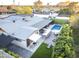 Aerial view of home showcasing the pool, patio, putting green and yard at 8114 E Arlington Rd, Scottsdale, AZ 85250