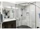 Modern bathroom featuring a glass enclosed shower with marble tiling and modern fixtures at 8114 E Arlington Rd, Scottsdale, AZ 85250