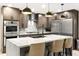 Spacious kitchen featuring stainless steel appliances, large island, and pendant lighting at 8114 E Arlington Rd, Scottsdale, AZ 85250