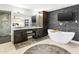 Elegant bathroom with a double vanity, soaking tub, and modern tile accents, perfect for relaxation and pampering at 8114 E Arlington Rd, Scottsdale, AZ 85250