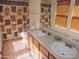 Dual sink vanity with tile flooring and wood blinds at 8163 E Posada Ave, Mesa, AZ 85212