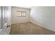 Bright bedroom showcasing plush carpet and neutral walls with wood blinds at 8163 E Posada Ave, Mesa, AZ 85212