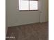 Bedroom with carpet, white walls and a large window at 8163 E Posada Ave, Mesa, AZ 85212