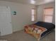 Bedroom with carpet, large window, closet and neutral walls at 8163 E Posada Ave, Mesa, AZ 85212