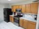 Kitchen features stainless steel appliances and wooden cabinets at 8163 E Posada Ave, Mesa, AZ 85212