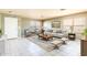 Inviting living room featuring neutral decor, a plush sofa, and ample natural light at 8163 E Posada Ave, Mesa, AZ 85212