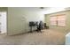 Inviting loft featuring neutral walls and carpet with a gaming setup at 8163 E Posada Ave, Mesa, AZ 85212