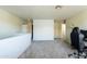 Spacious loft area with neutral paint and plush carpeting at 8163 E Posada Ave, Mesa, AZ 85212