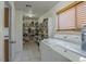Walk-in pantry with ample shelving, a window with blinds, and a washer and dryer at 8163 E Posada Ave, Mesa, AZ 85212