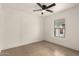 This is a clean bedroom featuring neutral tile, bright white walls, and one window at 833 S Toltec --, Mesa, AZ 85204