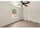 Bedroom with neutral paint, bright natural light, tile floor, and closet at 833 S Toltec --, Mesa, AZ 85204