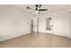 Neutral bedroom with tiled floor, bright white walls, and a doorway to another room at 833 S Toltec --, Mesa, AZ 85204