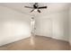 This is a clean bedroom featuring neutral tile, bright white walls, and closet at 833 S Toltec --, Mesa, AZ 85204