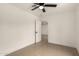 Neutral bedroom featuring tiled floors, a ceiling fan, and an open door at 833 S Toltec --, Mesa, AZ 85204