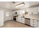 Well-lit kitchen featuring modern appliances, bright white cabinetry, and ample counter space at 833 S Toltec --, Mesa, AZ 85204