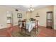 Charming dining room featuring a traditional table, chandelier, and a seamless connection to the cozy kitchen at 848 W Keating Ave, Mesa, AZ 85210