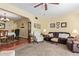 Warm living room with plush carpet and views into the dining area at 848 W Keating Ave, Mesa, AZ 85210