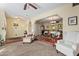 A spacious living room featuring an open floor plan into the dining room with plush carpet and neutral paint at 848 W Keating Ave, Mesa, AZ 85210