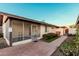 This backyard offers a screened-in patio and brick-paved area, ideal for outdoor gatherings and relaxation at 906 N Roosevelt Cir, Scottsdale, AZ 85257