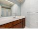 Bathroom with blue patterned wall and vanity with storage at 906 N Roosevelt Cir, Scottsdale, AZ 85257