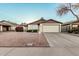 Charming single-story home with a well-maintained front yard and an attached two-car garage at 906 N Roosevelt Cir, Scottsdale, AZ 85257