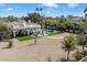 Aerial view of a desert home, showcasing pool, outdoor living space, and landscaping at 10050 N 58Th St, Paradise Valley, AZ 85253