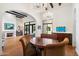 Dining area showcases a wooden table, comfortable chairs, and elegant lighting fixtures at 10050 N 58Th St, Paradise Valley, AZ 85253