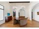Elegant dining room featuring a round wooden table and seating beneath two crystal chandeliers at 10050 N 58Th St, Paradise Valley, AZ 85253