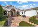 Inviting front porch with brickwork, manicured hedges, and a wrought-iron gate at 10050 N 58Th St, Paradise Valley, AZ 85253