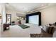 Spacious game room with a golf simulator, large window for natural light, and comfortable seating at 10050 N 58Th St, Paradise Valley, AZ 85253