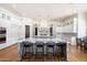 Spacious white kitchen with double islands, high-end appliances, and breakfast bar seating at 10050 N 58Th St, Paradise Valley, AZ 85253