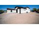 Backyard with brick paved driveway and potential parking space at 10105 E Cactus Rd, Scottsdale, AZ 85260